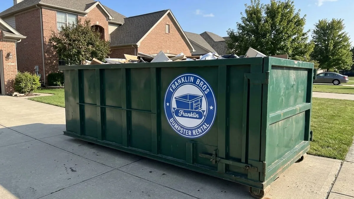 Dumpster rental in Franklin, TN Franklin Bros Dumpster Rental roll-off dumpster being delivered to a Franklin, Tennessee driveway